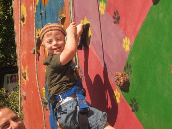 A boy with Down Syndrome gets to go rock climbing at a Heart of Benjamin Passover Camp