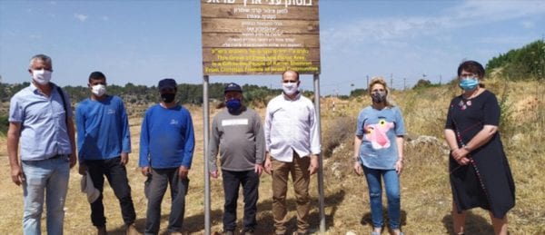 Mayor Yigal Lahav of Karnei Shomron (left), Sondra Oster Baras (right), and local workers planted your trees in a new grove in Karnei Shomron