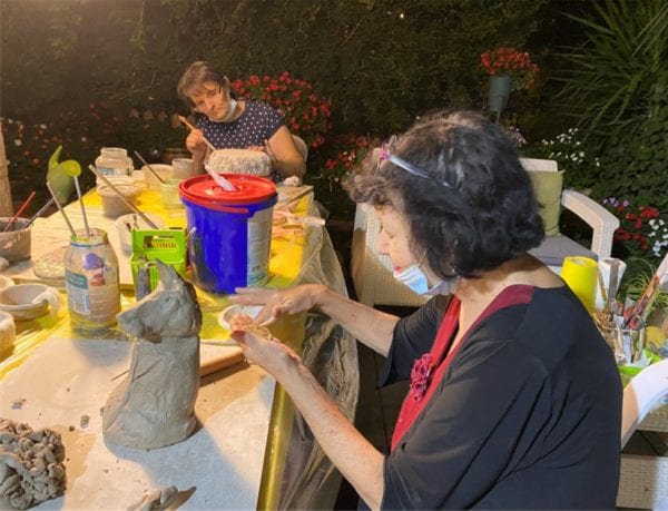 Seniors in Har Gilo, one of the Gush Etzion communities, participate in a ceramics workshop for occupational therapy and social-distanced socializing.